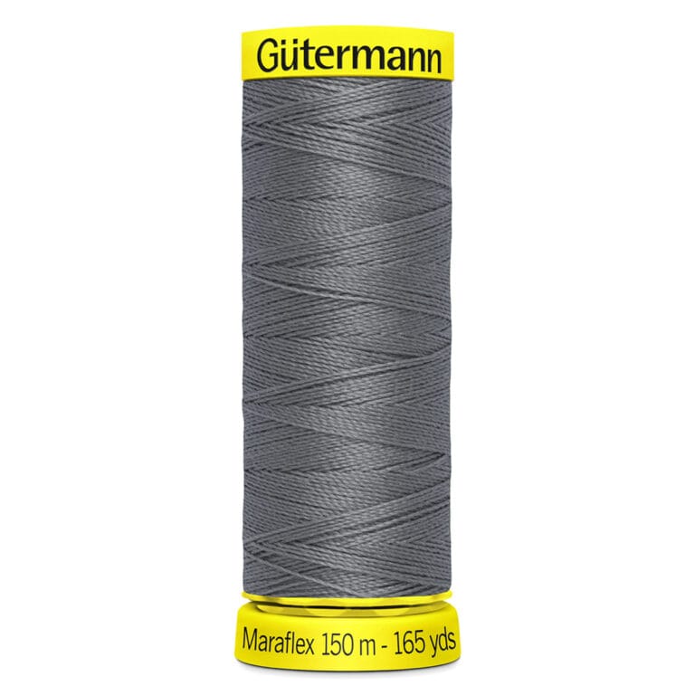 A spool of Gütermann Maraflex thread in a dark gray color. The spool is wrapped with thread and has yellow labels on top and bottom. The bottom label reads "Maraflex 150 m - 165 yds.