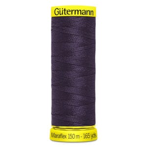 A spool of Gütermann Maraflex thread, in a dark purple color, with yellow labels on top and bottom. The bottom label reads "Maraflex 150 m - 165 yds.