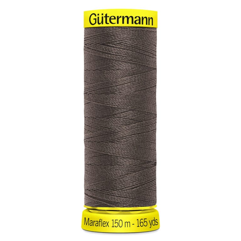 A spool of Gütermann Maraflex thread in dark gray, labeled as 150 meters or 165 yards. The spool has bright yellow ends with the brand name printed on top.