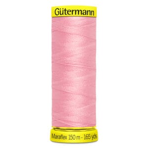 A spool of Gütermann Maraflex thread in pink, labeled with "150 m - 165 yds" on the base.