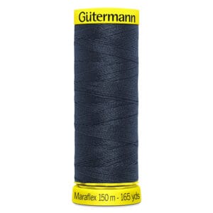 A spool of Gütermann Maraflex thread, 150 meters or 165 yards, displayed vertically. The thread is dark blue, with the label on top and bottom showing the brand and length details in yellow and black.