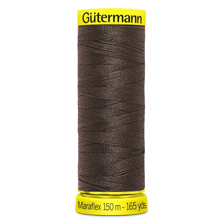 A spool of Gütermann Maraflex thread, colored dark brown. The spool has a yellow top and bottom, with the brand name "Gütermann" on top and "Maraflex 150 m - 165 yds" on the bottom.