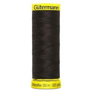 A spool of Gütermann Maraflex elastic thread in dark color, labeled with 150 meters and 165 yards, with bright yellow caps at the top and bottom.