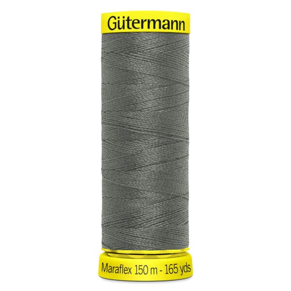 A spool of Gütermann thread labeled "Maraflex 150 m - 165 yds" in dark gray. The spool has bright yellow caps at the top and bottom.