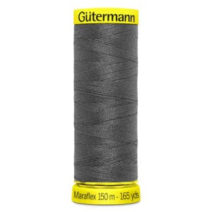 A spool of Gütermann Maraflex thread, 150 meters (165 yards), in dark gray color. The spool has a bright yellow top and bottom.