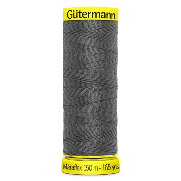 A spool of Gütermann Maraflex thread, 150 meters (165 yards), in dark gray color. The spool has a bright yellow top and bottom.