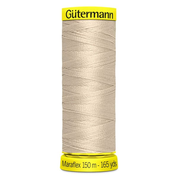 A spool of Gutermann Maraflex thread is shown, wrapped with light beige thread. The top is labeled "Gutermann" in black on a yellow background, and the bottom indicates "Maraflex 150 m - 165 yds.