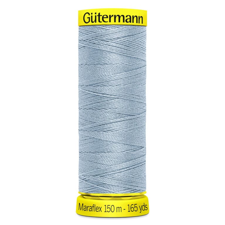 Spool of Gütermann Maraflex thread in light blue color on a yellow spool. The label indicates 150 meters (165 yards) of thread.