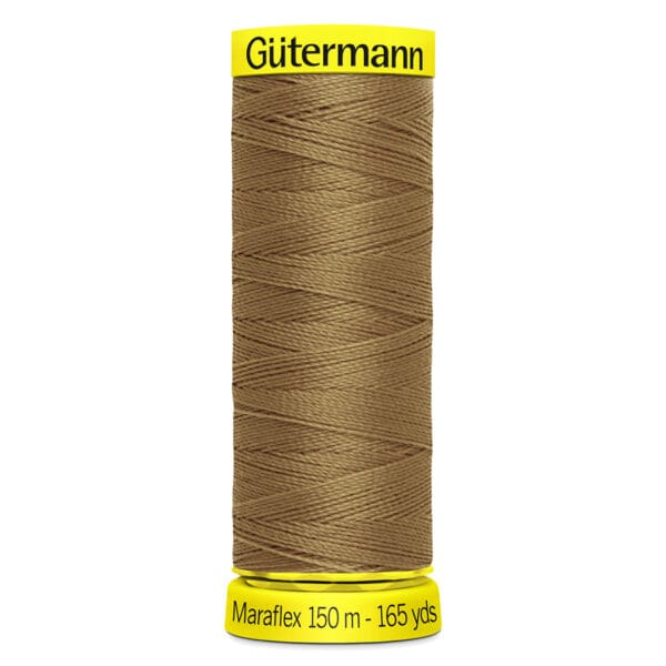 A spool of Gütermann Maraflex thread, 150 meters (165 yards) long, with brown thread. The spool has a bright yellow top and base, with the brand name "Gütermann" and product details printed in black.
