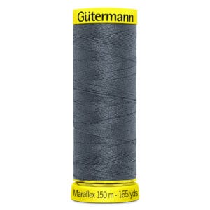 A spool of Gütermann Maraflex thread, 150 meters (165 yards), in dark gray. The spool has yellow labeling at the top and bottom with the brand "Gütermann" and thread details displayed.