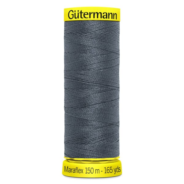 A spool of Gütermann Maraflex thread, 150 meters (165 yards), in dark gray. The spool has yellow labeling at the top and bottom with the brand "Gütermann" and thread details displayed.
