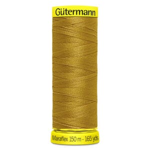 A spool of Gütermann Maraflex thread in a mustard yellow color. The spool label indicates it contains 150 meters (165 yards) of thread.