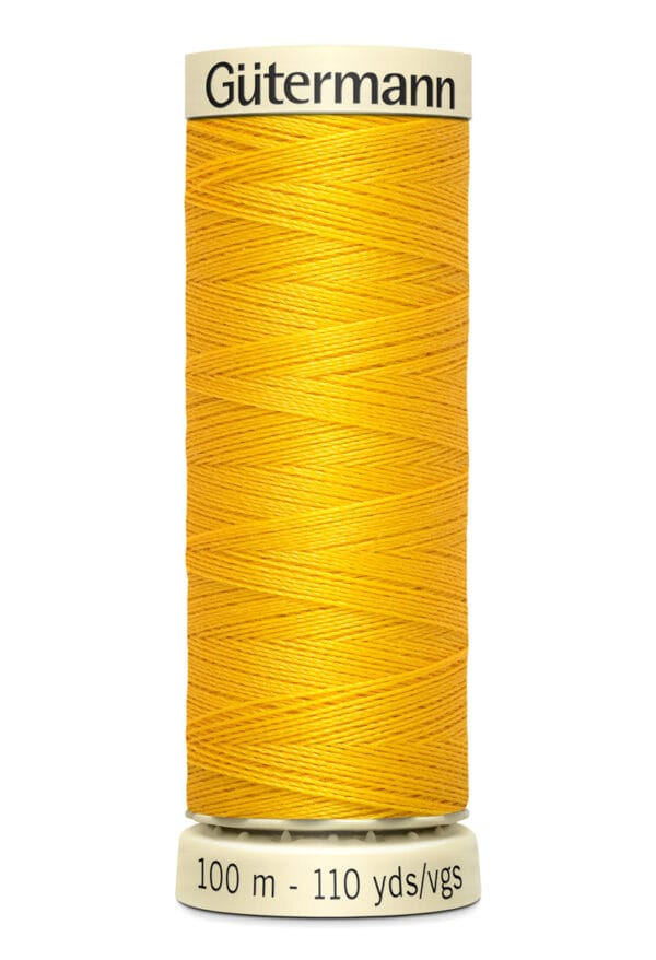 Spool of Gütermann sewing thread in bright yellow color, labeled with "100 m - 110 yds/vgs" on the base.