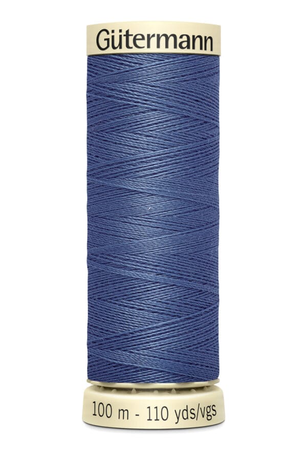 A spool of Gütermann thread in blue, labeled "100 m - 110 yds/vgs.