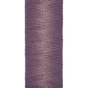 A spool of Gütermann thread in a muted purple color. The label indicates it contains 100 meters (110 yards) of thread.