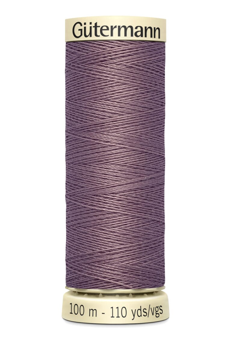 A spool of Gütermann thread in a muted purple color. The label indicates it contains 100 meters (110 yards) of thread.