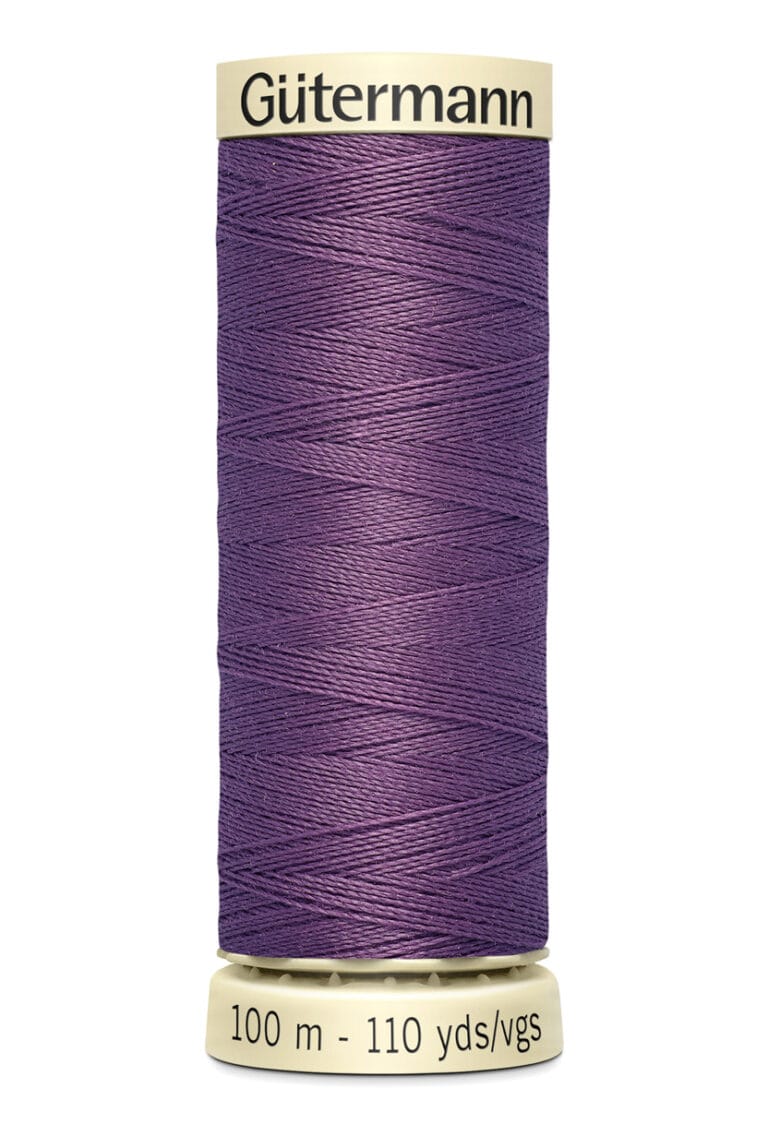 A spool of Gütermann sewing thread in deep purple. The label shows the thread is 100 meters or 110 yards long.