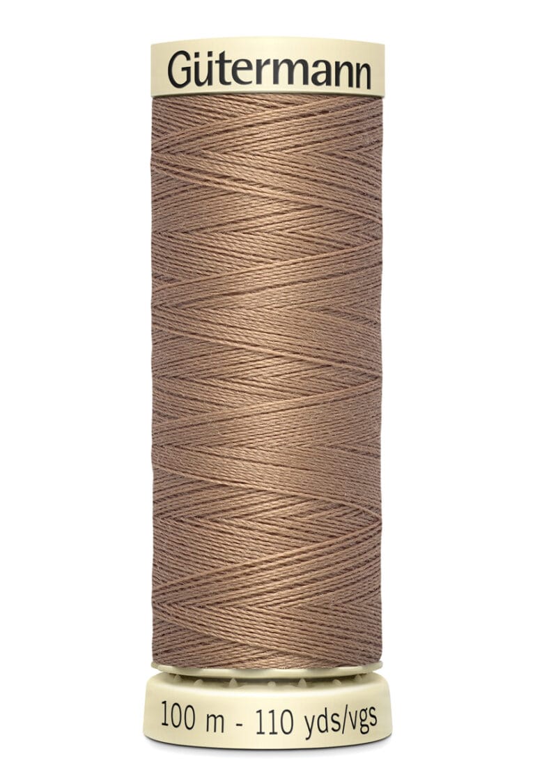 Spool of brown Gütermann sewing thread with labels showing length as 100 meters or 110 yards.