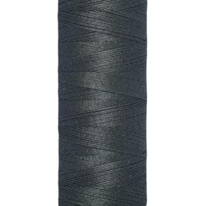 A spool of Gütermann sewing thread in dark blue, with text on the label indicating 100 meters and 110 yards. The spool has a beige top and bottom.