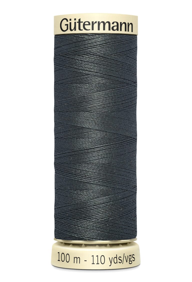 A spool of Gütermann sewing thread in dark blue, with text on the label indicating 100 meters and 110 yards. The spool has a beige top and bottom.