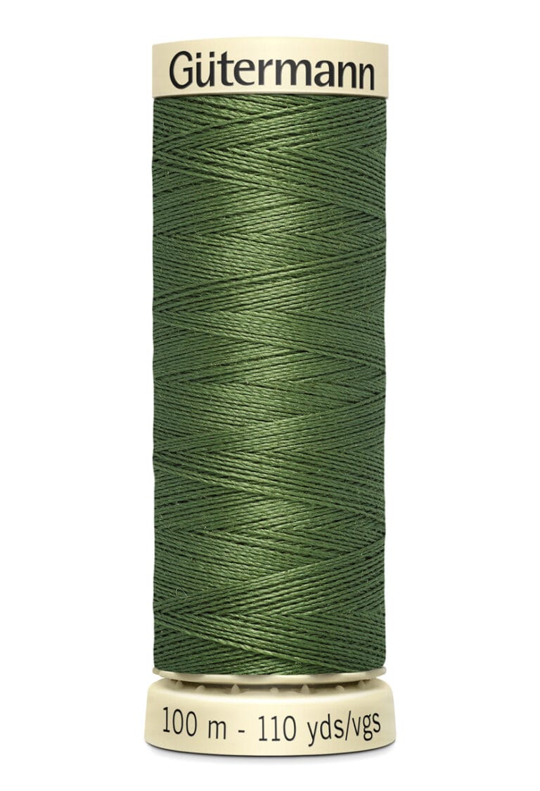 A spool of Gütermann green sewing thread, wrapped neatly around a beige plastic spool. The label indicates 100 meters or 110 yards/vgs.