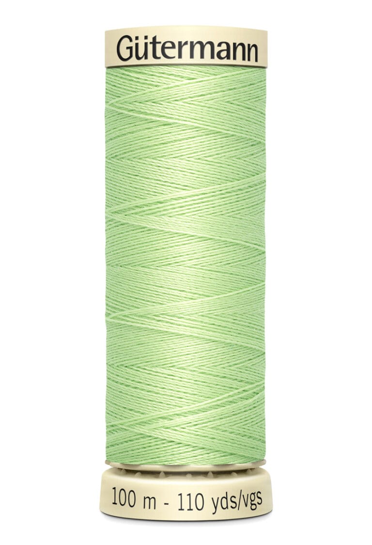 A spool of Gütermann sewing thread in light green color. The spool label shows "100 m - 110 yds/vgs." The thread is tightly wound around the beige cylindrical spool, prominently displaying the brand name at the top.