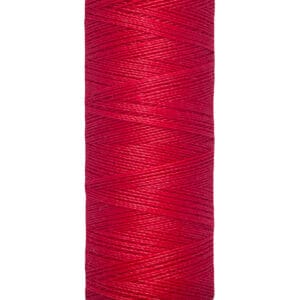 A spool of Gütermann sewing thread in vibrant red, with a label indicating 100 meters or 110 yards. The spool is cylindrical with cream-colored ends featuring the brand name at the top.