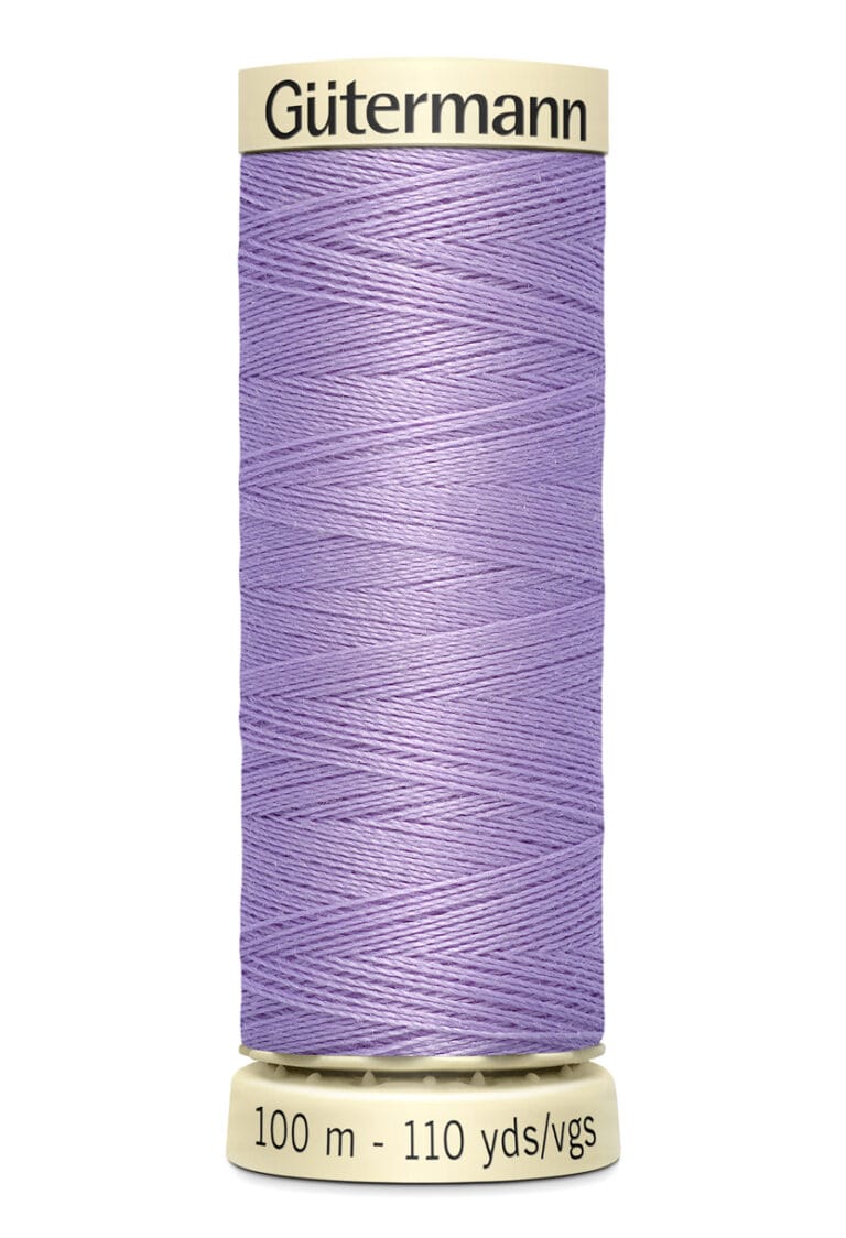 A spool of Gütermann thread with 100 meters (110 yards) of light purple thread. The spool has a cream-colored top and base, displaying the brand name and length details.