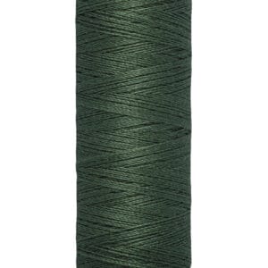 A spool of Gütermann thread with dark green color, labeled "100 m - 110 yds/vgs" at the bottom. The spool has a beige top and bottom, with the brand name "Gütermann" printed on the top section.