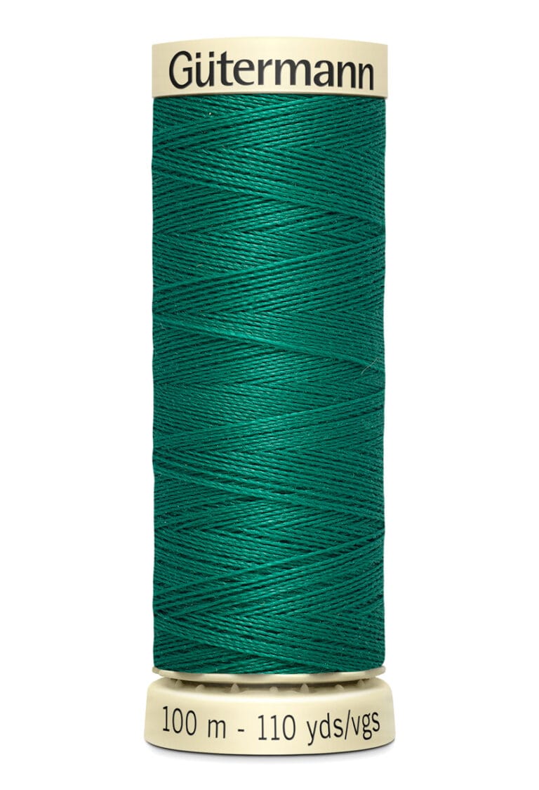 A spool of Gütermann sewing thread, green in color, with 100 meters (110 yards) labeled on the base.