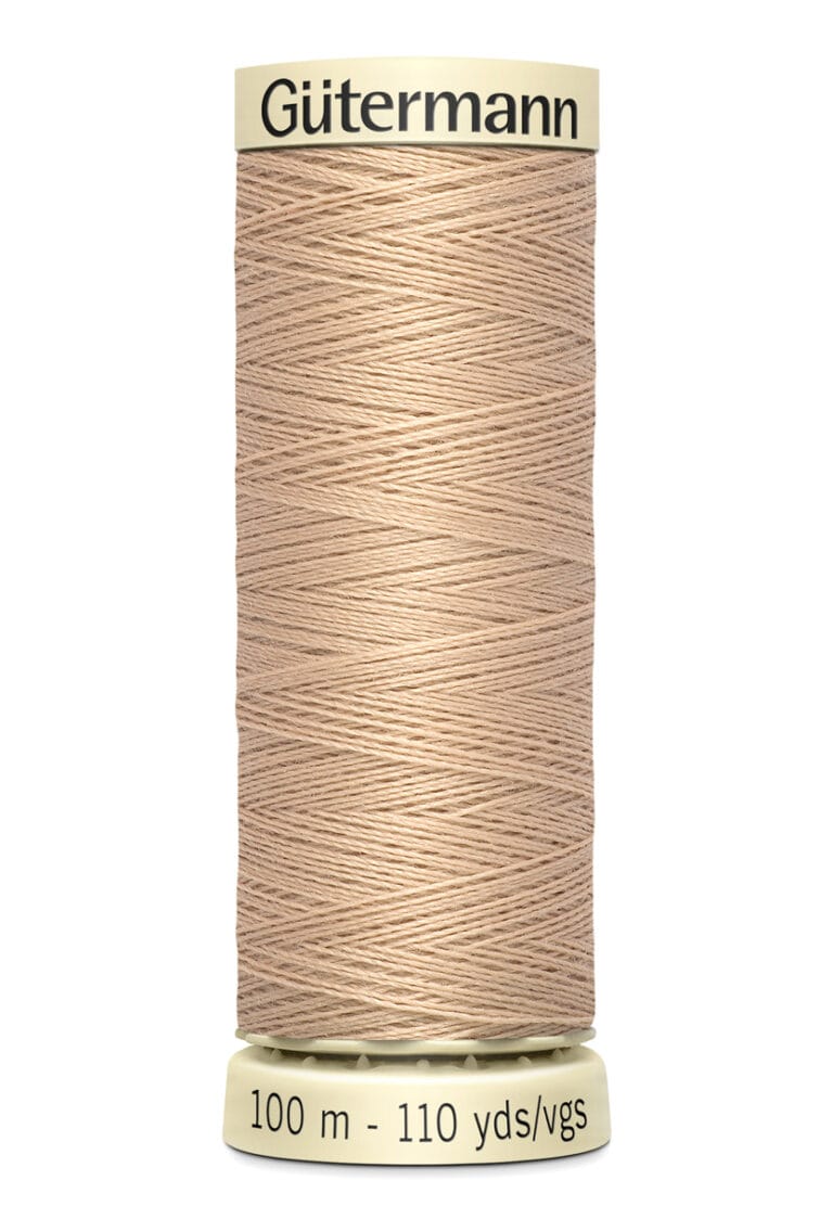 A spool of Gütermann thread in beige color, labeled with "100 m - 110 yds/vgs" on the bottom and "Gütermann" on the top.