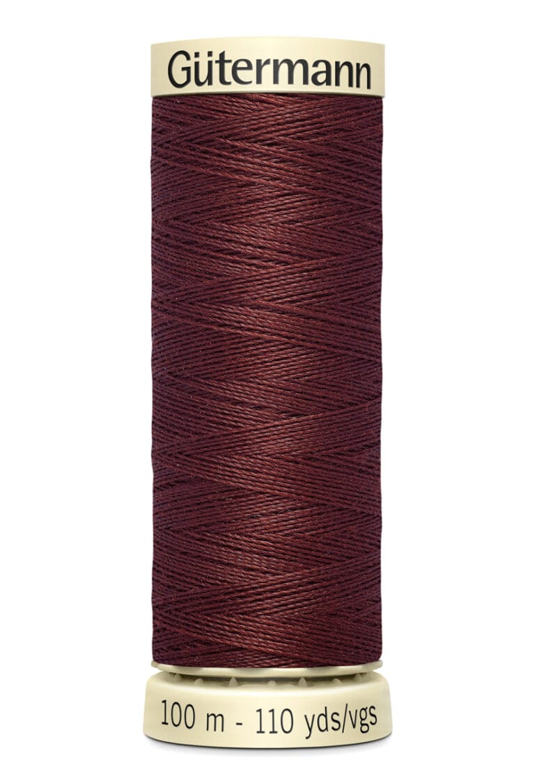 Spool of Gütermann dark red thread labeled 100 m - 110 yds/vgs.