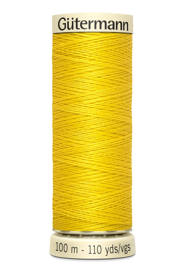 Spool of Gütermann yellow sewing thread, labeled with 100 meters and 110 yards, set against a white background.