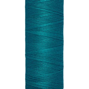 A spool of Gütermann thread in teal, with labels indicating 100 meters and 110 yards. The spool is cylindrical, with the brand name displayed at the top and the length details at the bottom.