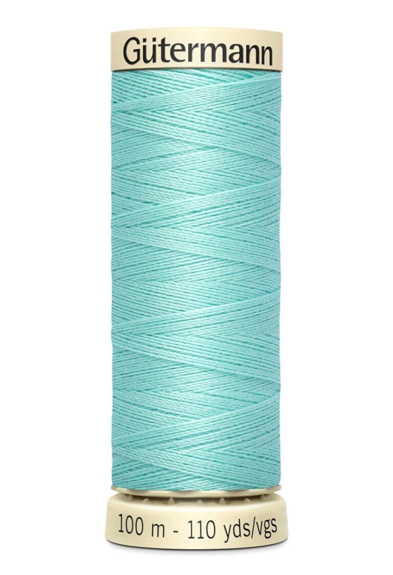 A spool of turquoise Gütermann sewing thread, with labels indicating 100 meters and 110 yards. The spool is cream-colored on top and bottom.