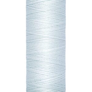 A spool of Gütermann thread in light blue, wrapped uniformly around a beige spool. The label indicates the length as 100 meters or 110 yards.