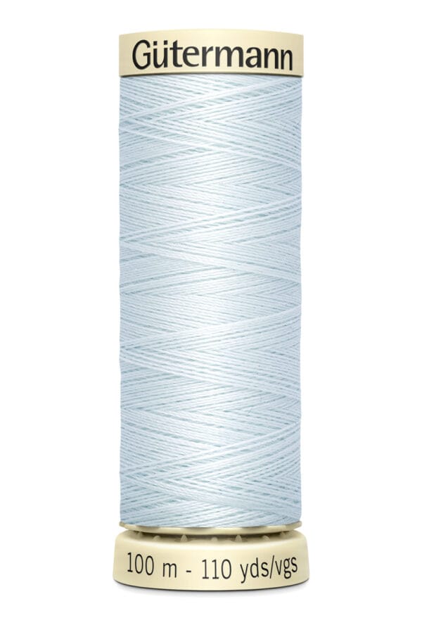 A spool of Gütermann thread in light blue, wrapped uniformly around a beige spool. The label indicates the length as 100 meters or 110 yards.