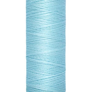 A spool of Gutermann sewing thread, light blue in color, with labels indicating 100 meters and 110 yards.