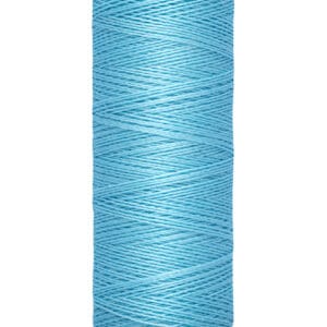 A spool of Gütermann sewing thread in light blue. The spool is cylindrical and labeled with "100 m - 110 yds" at the base. The thread is neatly wound around the spool.