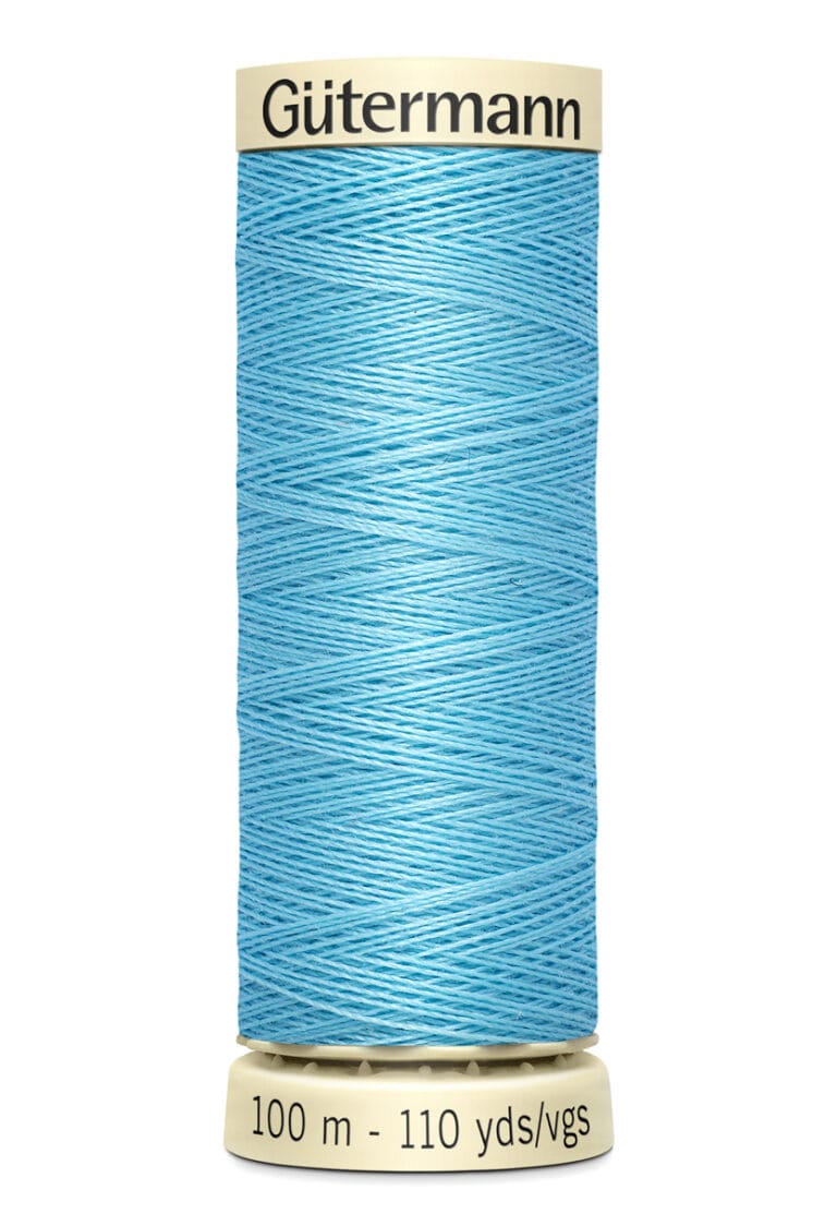 A spool of Gütermann sewing thread in light blue. The spool is cylindrical and labeled with "100 m - 110 yds" at the base. The thread is neatly wound around the spool.