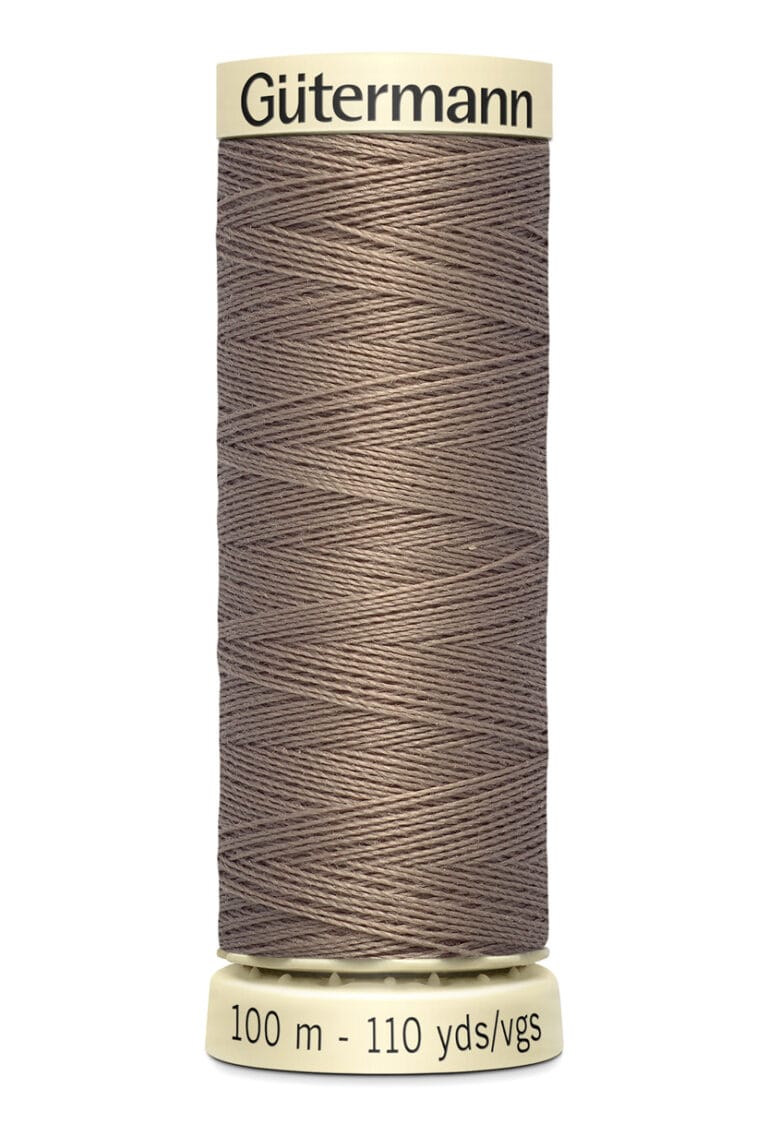 A spool of Gütermann thread in a light brown color. The spool holds 100 meters or 110 yards of thread.