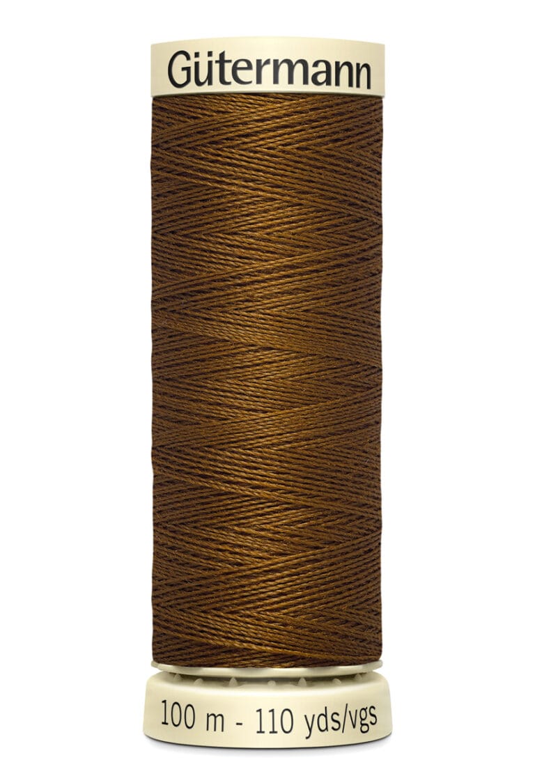 A spool of Gütermann thread in brown, wrapped neatly around a cylindrical spool. The label reads "100 m - 110 yds/vgs," indicating the thread length.