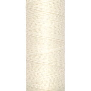 A spool of Gutermann thread with off-white color, labeled as 100 meters or 110 yards. The thread is neatly wound around a cylindrical spool with beige ends, displaying the brand name and length in both metric and imperial units.