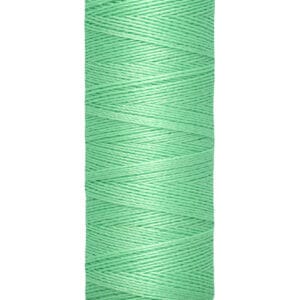 A spool of Gütermann thread in a soft mint green color. The label indicates 100 meters or 110 yards.