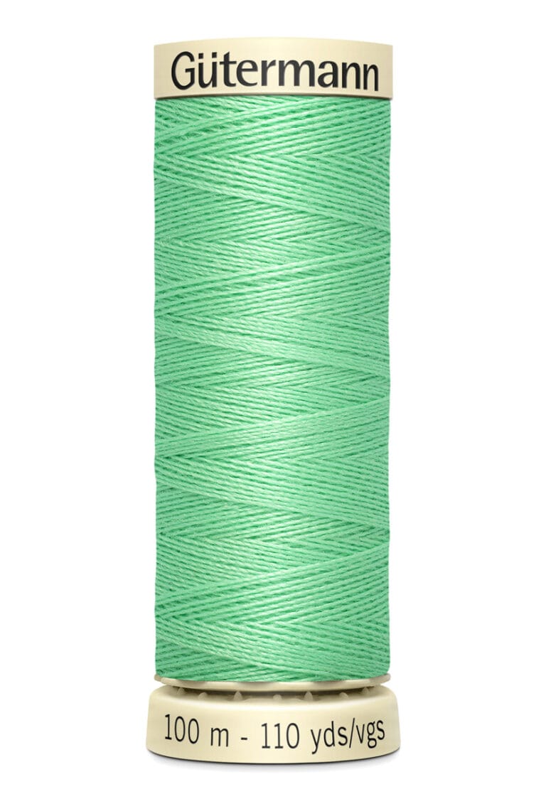 A spool of Gütermann thread in a soft mint green color. The label indicates 100 meters or 110 yards.