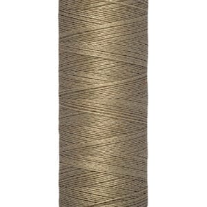 A spool of Gütermann sewing thread, beige in color, with labels indicating 100 meters or 110 yards of length. The spool is vertically oriented and has a light yellow base and top.