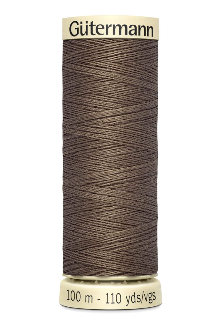 A spool of Gütermann sewing thread, brown in color, with a label indicating 100 meters or 110 yards.