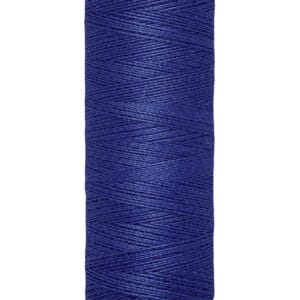 A spool of Gütermann blue sewing thread is shown. The spool is cylindrical and beige, with the brand name at the top. It holds 100 meters or 110 yards of thread.