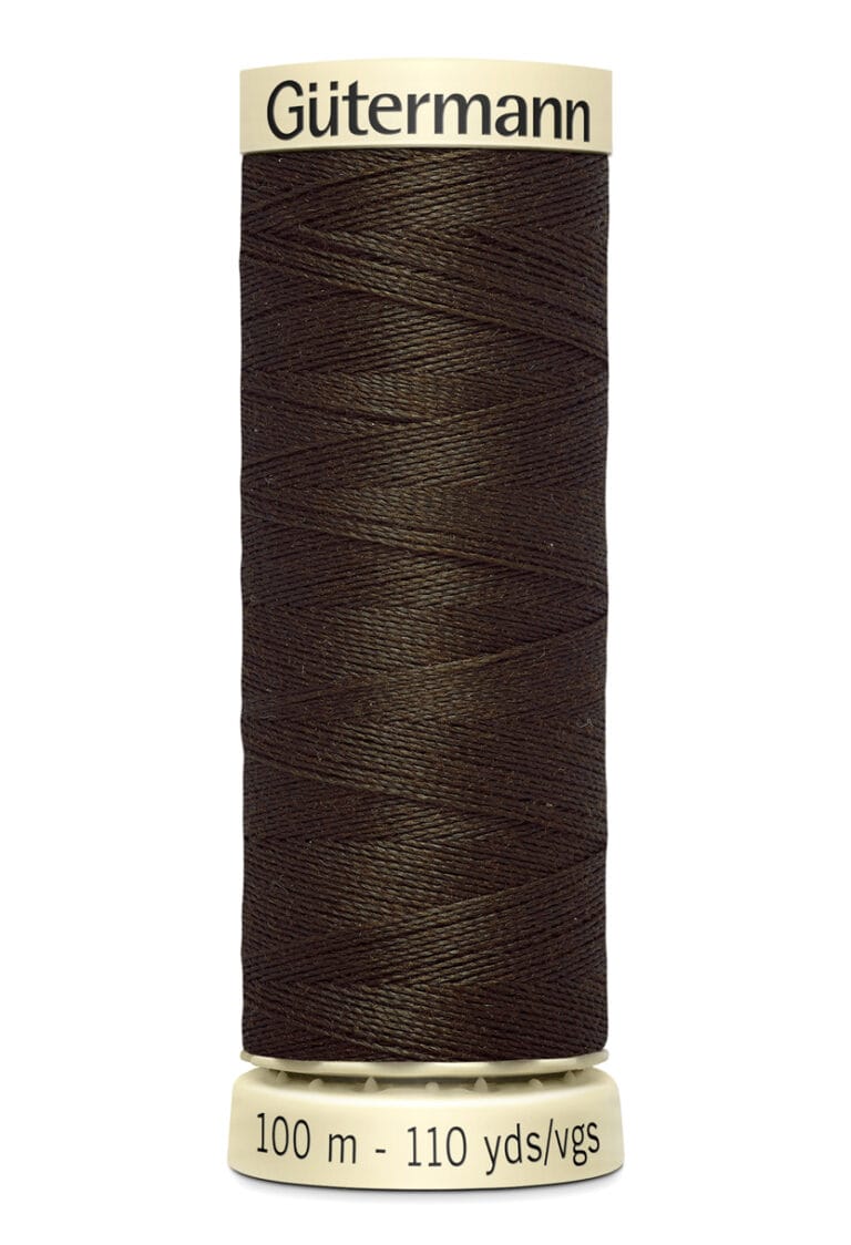 A spool of Gütermann sewing thread, dark brown in color, wound neatly on a cream-colored plastic reel. The spool is labeled with "Gütermann" at the top and "100 m - 110 yds/vgs" at the bottom.