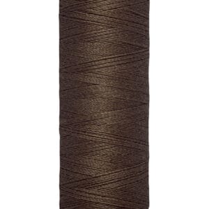 A spool of Gütermann thread in dark brown, labeled for 100 meters or 110 yards. The thread is neatly wound on a cream-colored cylinder with the brand name at the top.